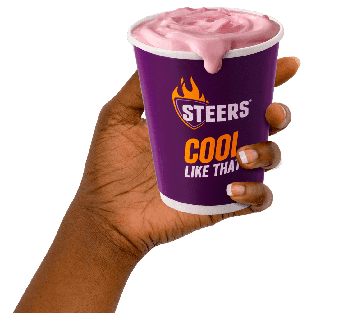 - Hand holding takeaway milkshake from Steers
