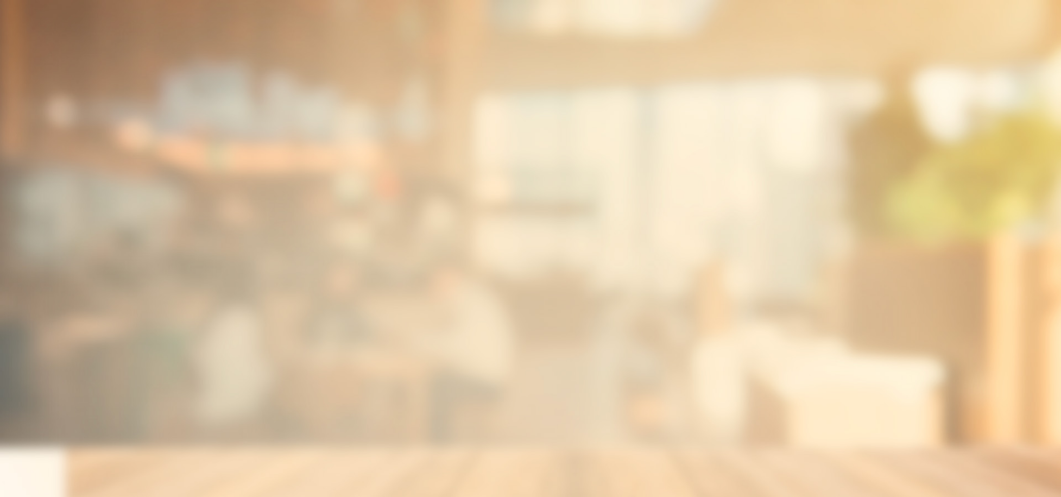Blurred warm-toned Steers restaurant interior with a wooden table in the foreground Blurred warm-toned Steers restaurant interior with a wooden table in the foreground
