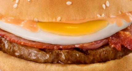 Close-up of a Steers breakfast burger with fried egg, bacon and beef patty