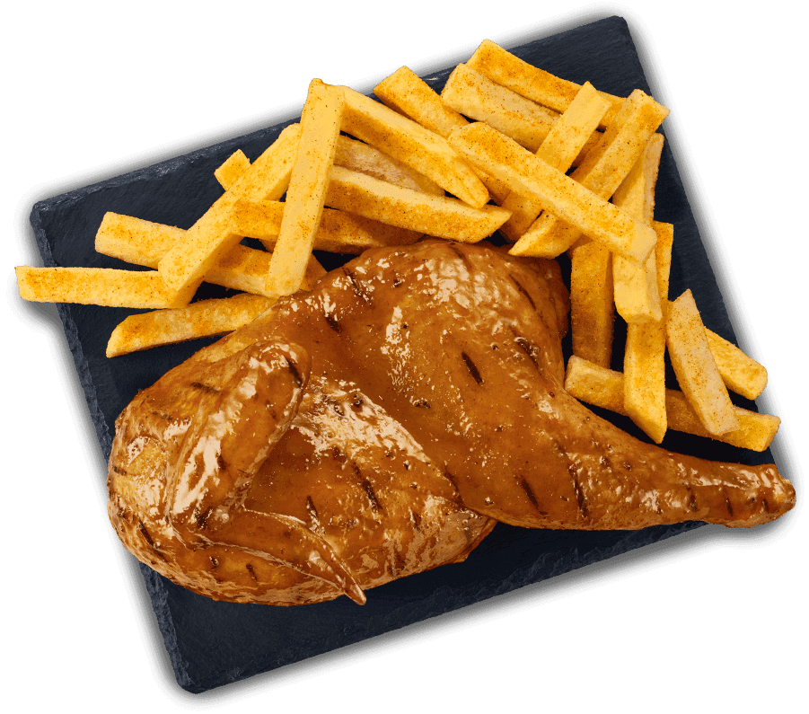 Flame grilled half chicken served with seasoned chips on a black slate tray