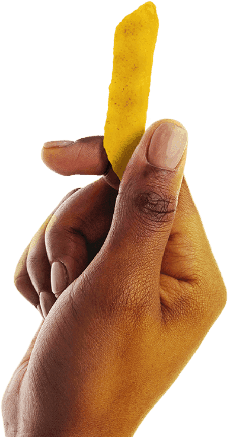 Close-up of a hand holding a single seasoned potato chip