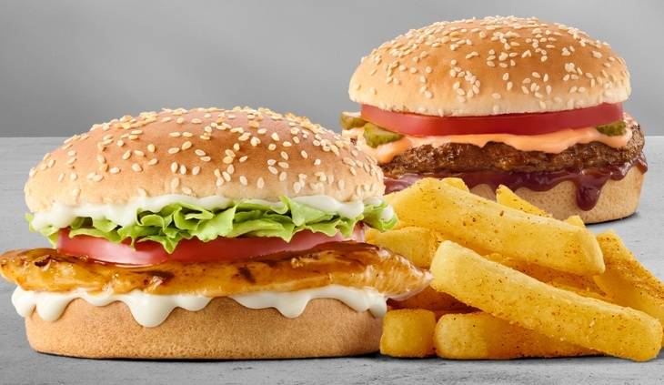 Grilled chicken burger and juicy beef burger with fresh lettuce, tomato, creamy sauce and crispy seasoned chips
