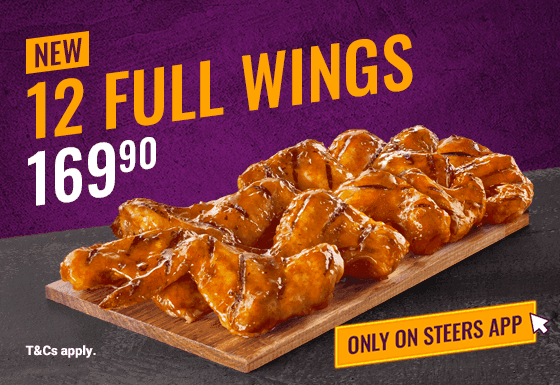 12 Full Chicken Wings on a black slate